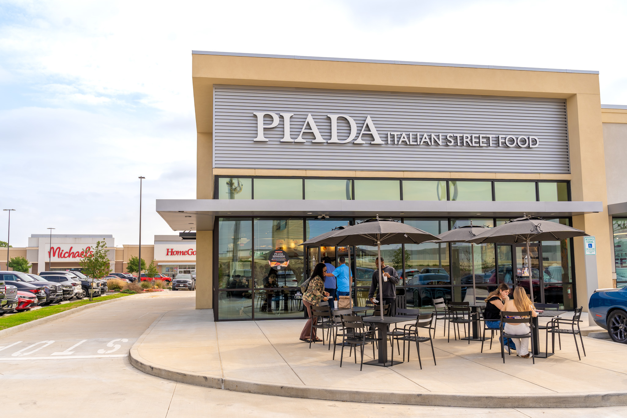 Piada Grand Morton Texas storefront exterior with patio seating and customers