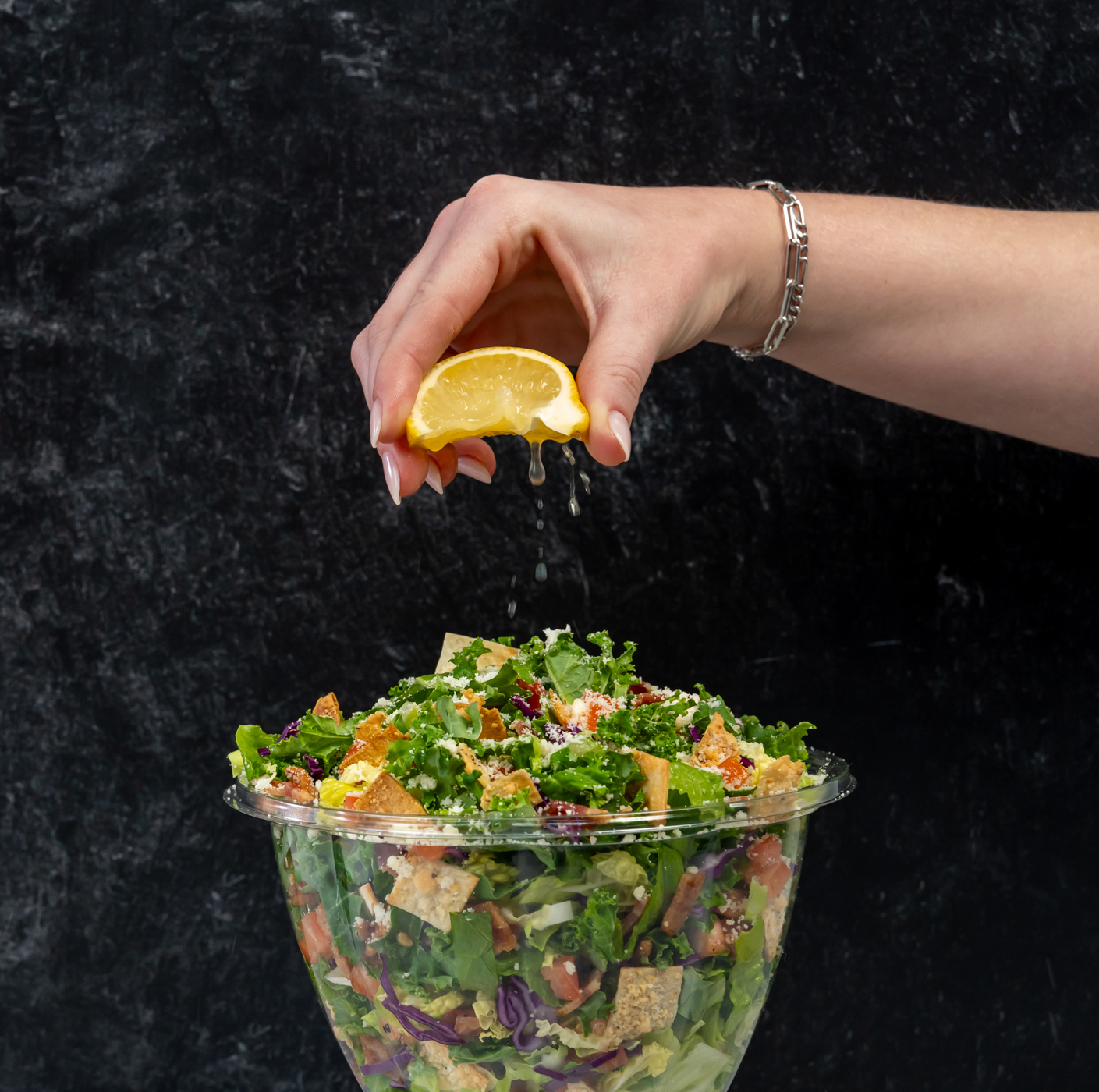 Piada lemon kale caesar salad with fresh lemon squeeze