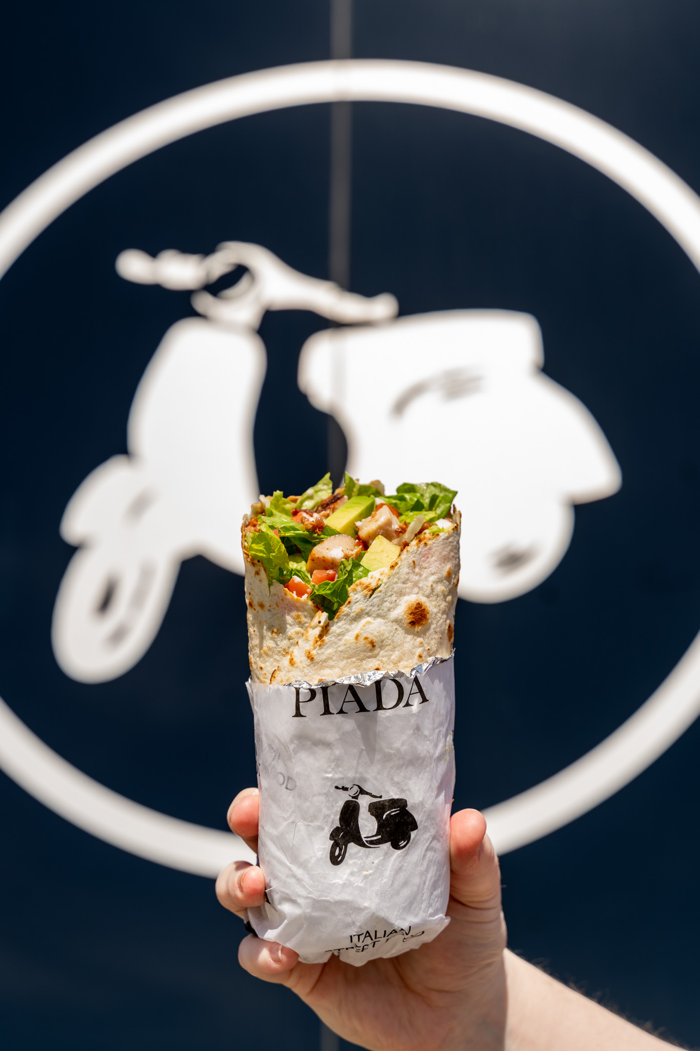 Signature Piada wrap with the brand scooter logo